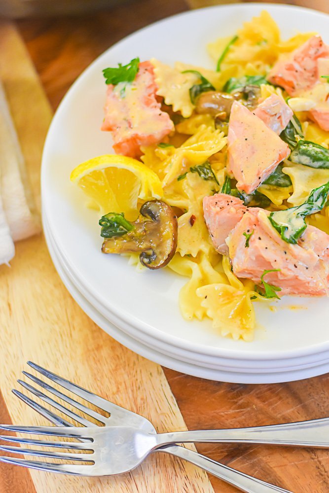 closeup of plate of salmon pasta with spicy cream sauce