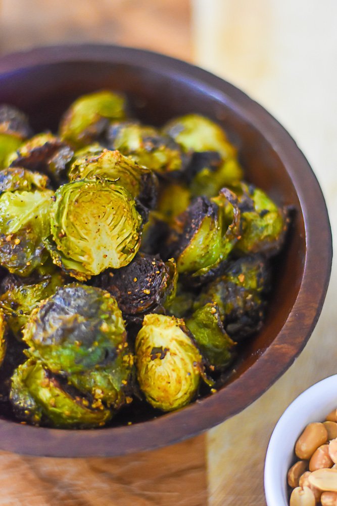 crispy roasted brussels sprouts seasoned with suya spice blend.