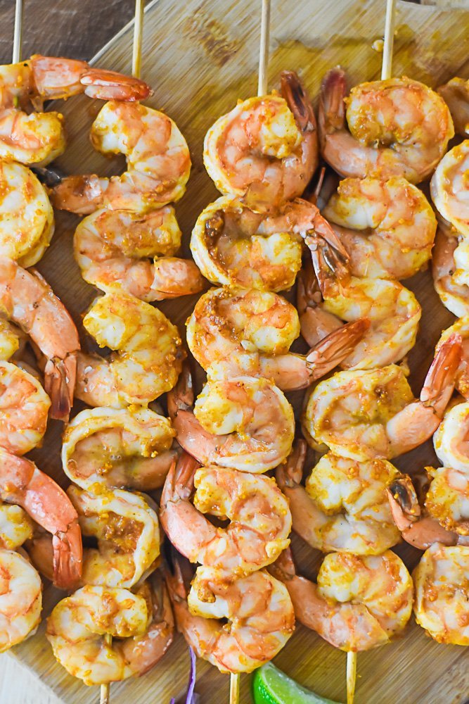 cooked suya shrimps on skewers.