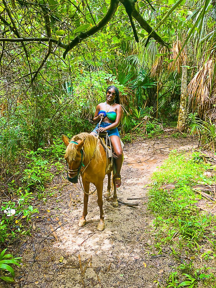 Jazzmine on horse in Cozumel jungle.