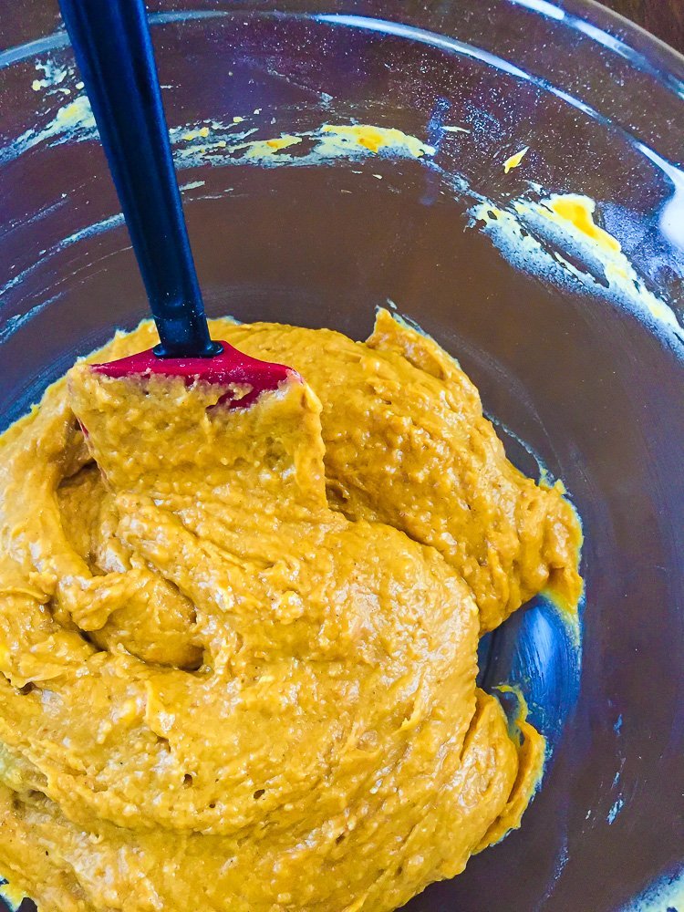 pumpkin spice cake batter in a mixing bowl.