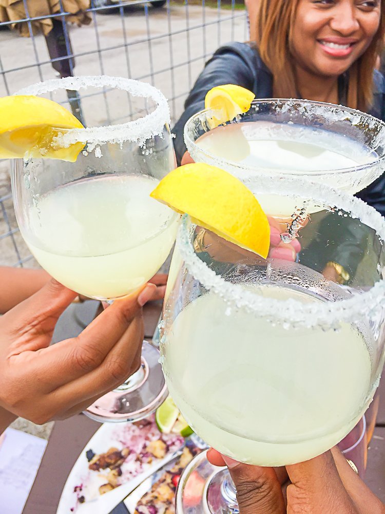 women toasting mimosas at Bar 5015 in Third Ward Houston.