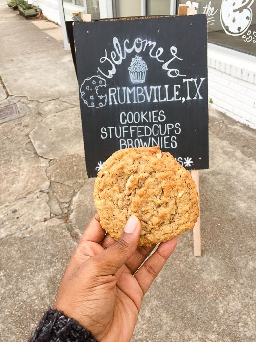 holding cookie outside Crumbville, TX in Third Ward.