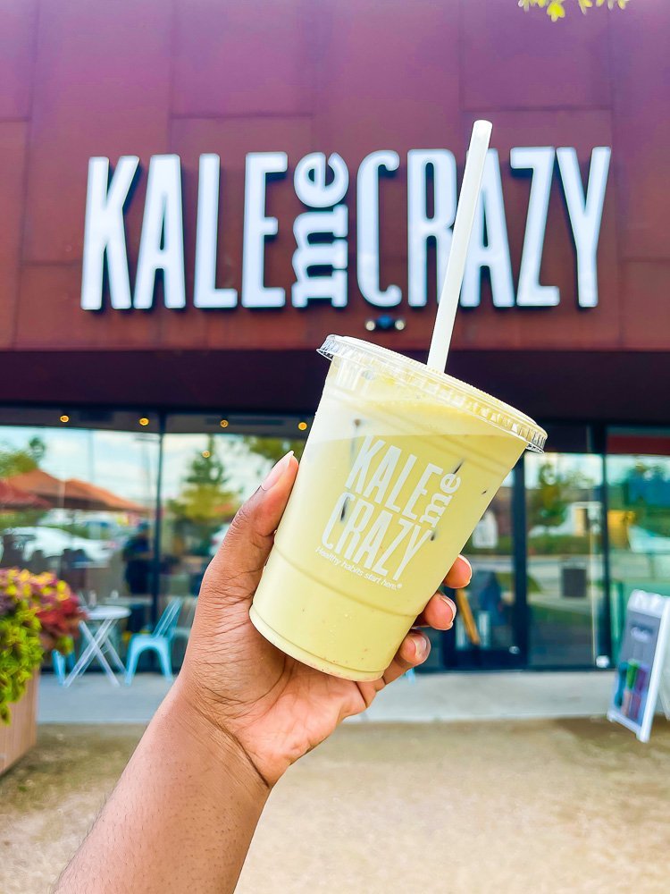 holding up iced matcha at Kale Me Crazy Houston Heights.