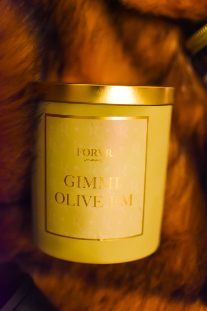 Gimme Olive 'Em candle from Forvr Mood in light green jar with gold lid.