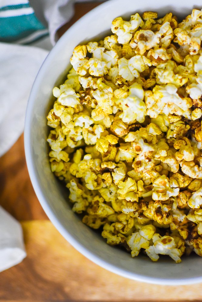 bowl of microwave popcorn seasoned with chai spices.