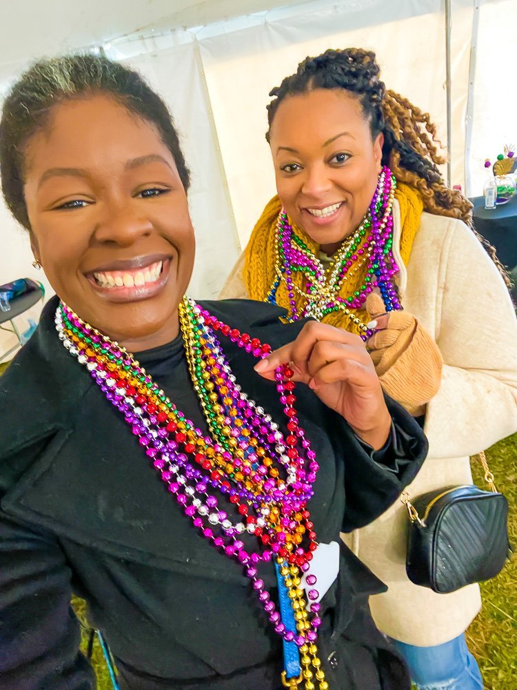 Jazzmine and Erika showing off Mardi Gras beads.