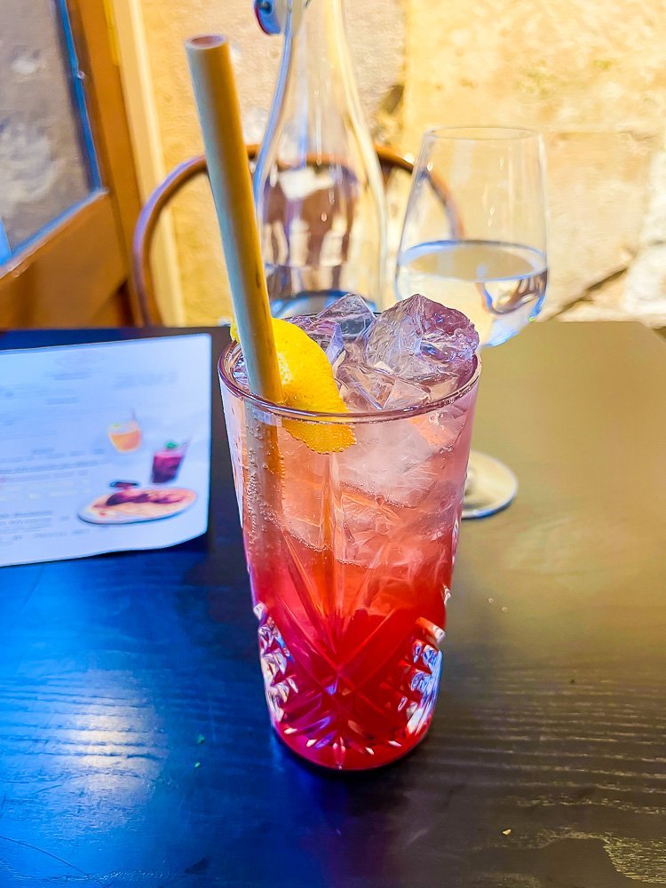 hibiscus gin cocktail at Table Metis restaurant in France.