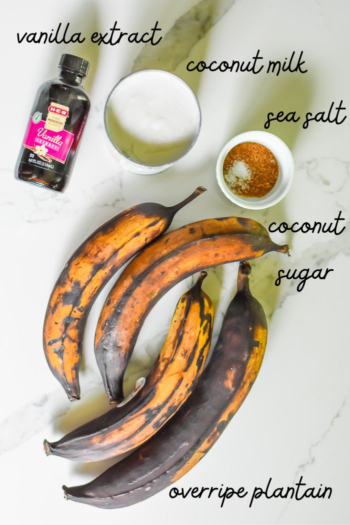 vanilla extract, overripe plantains, coconut sugar, sea salt, and coconut milk on countertop.