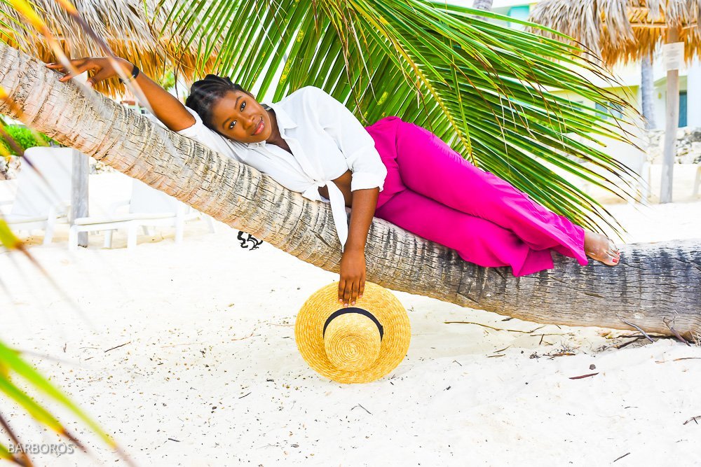 Jazzming laying on curved palm tree on playa doña matilde.