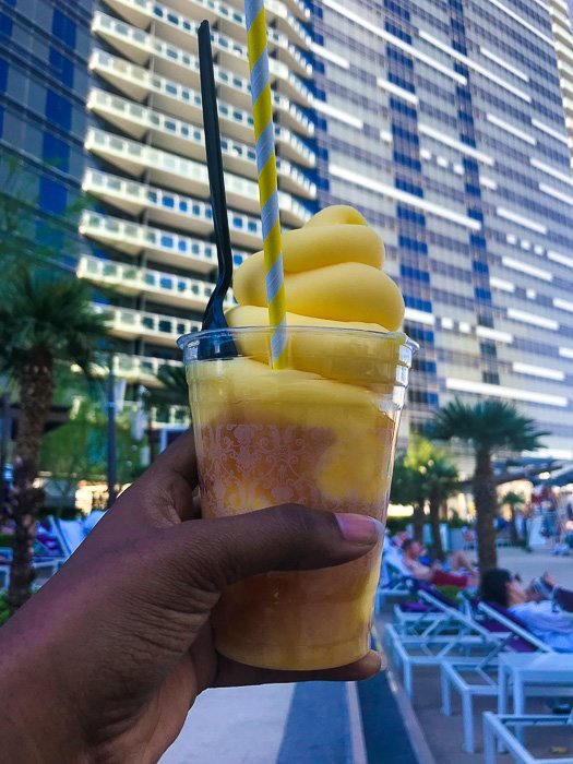 holding rum dole whip at The Chelsea Pool.