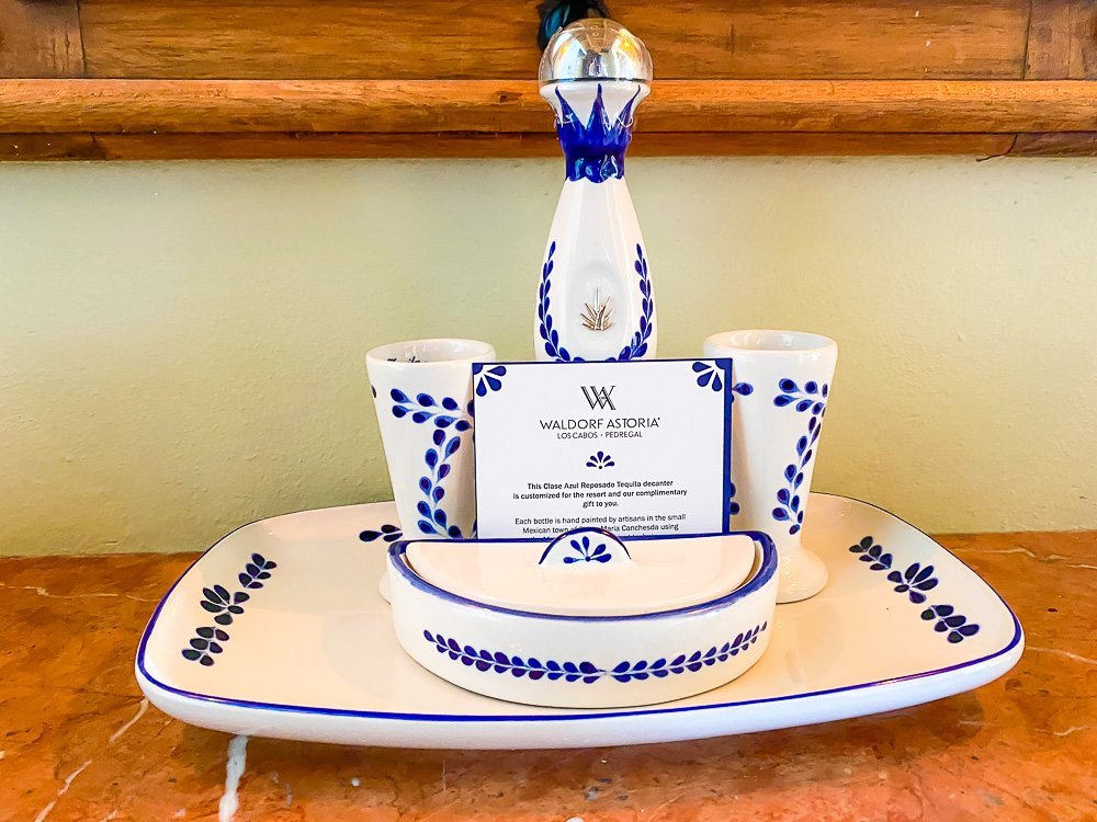 complimentary bottle of Clase Azul tequila with matching decorative tray and set of glasses.