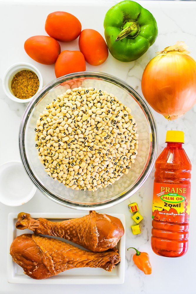 ingredients for Nigerian stewed beans recipe on granite counter top.