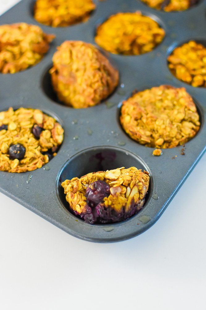 blueberry almond baked oatmeal cup in cupcake pan.
