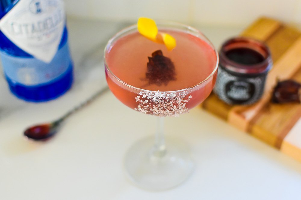 bubbly French 75 with candied hibiscus floating in the center.