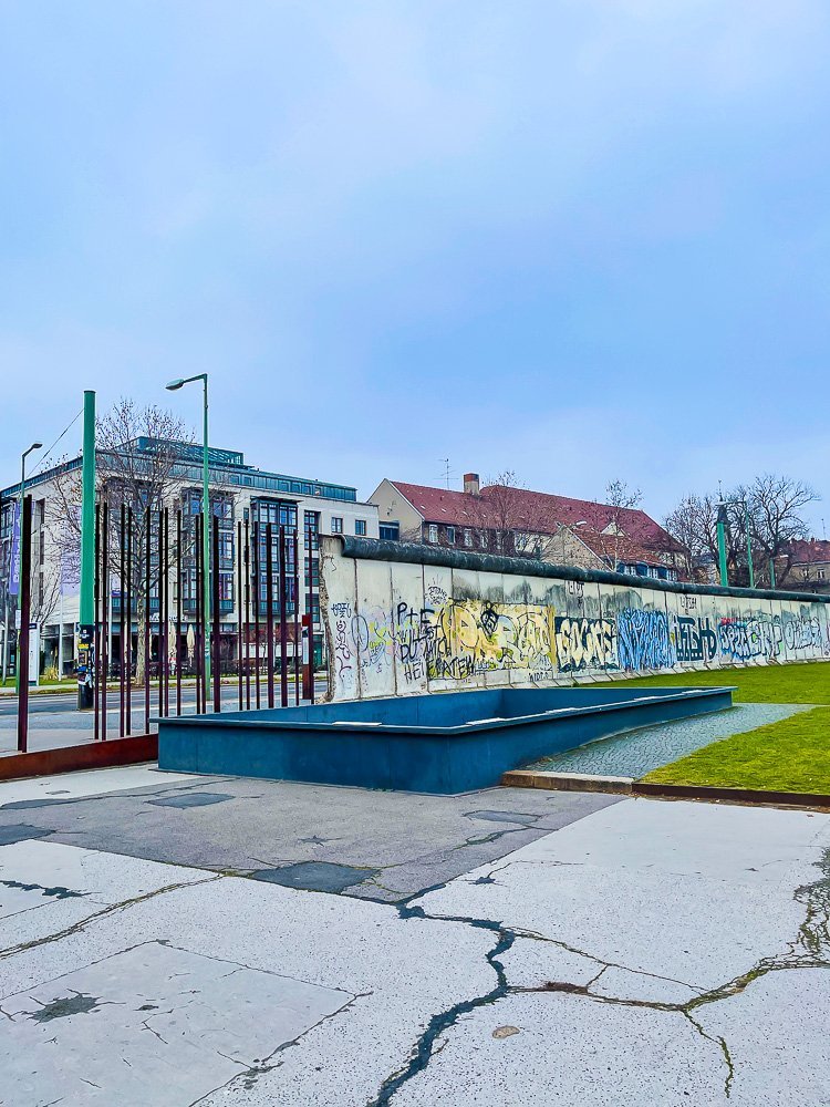 Berlin Wall Memorial partially covered in graffiti.