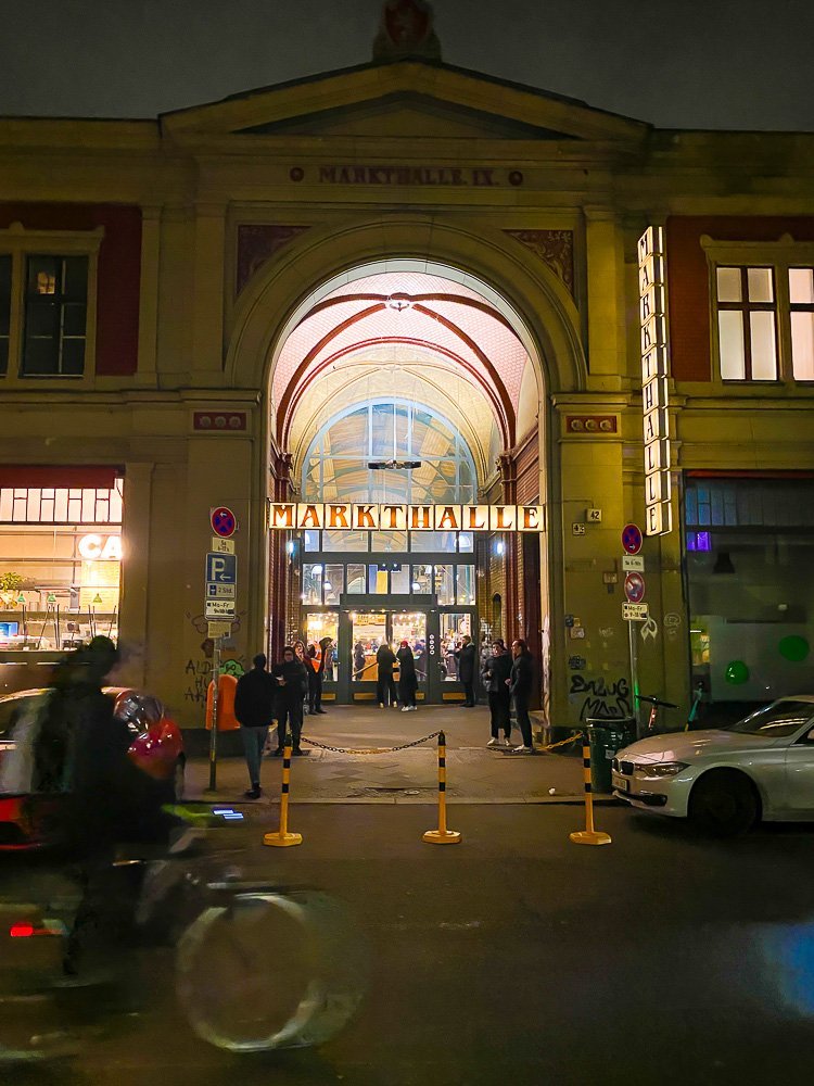 entrance to Markethalle Neun at nighttime in Berlin.