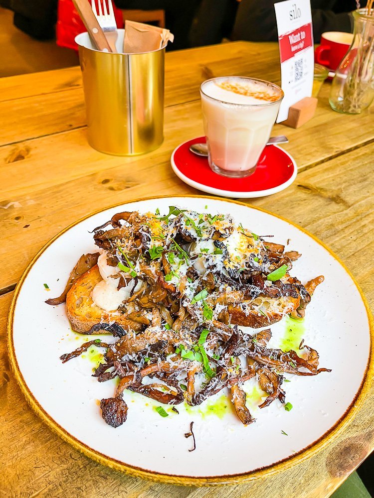 truffle mushrooms and eggs on toast with a chai latte at Silo Coffeehouse, Berlin.