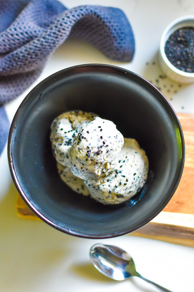 bowl of three scoops of no-churn vegan black sesame seed ice cream.