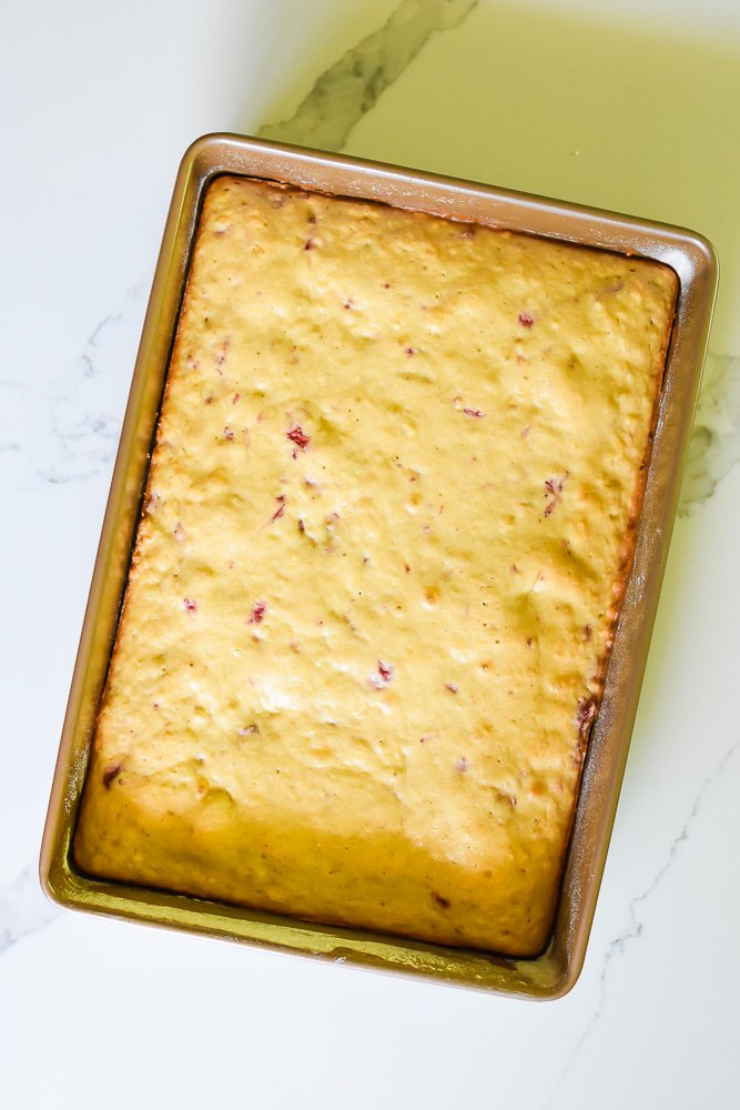 baked strawberry sheet cake in pan.