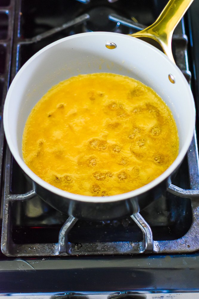praline sauce bubbling on stove in small saucepan.