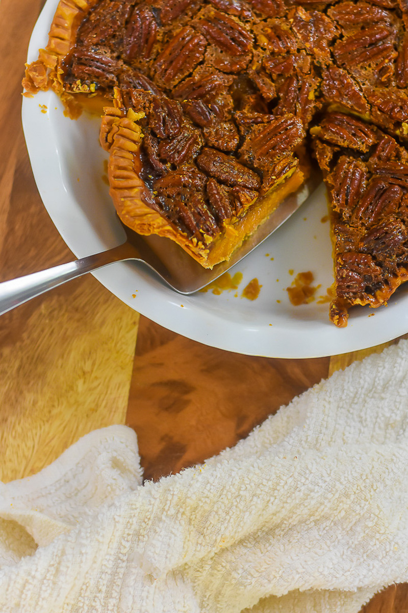 sliced sweet potato and bourbon pecan pie in white pie plate.