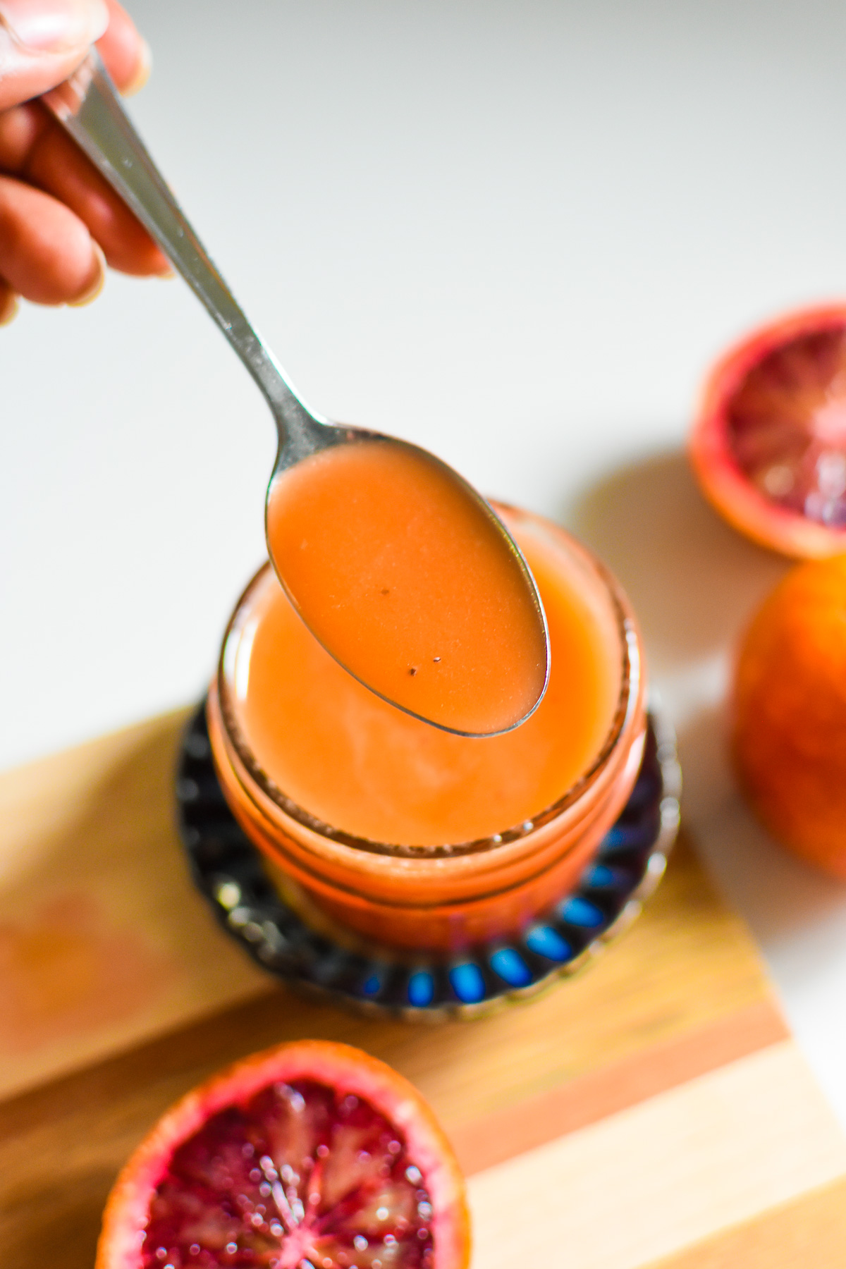 spoonful of the best blood orange vinaigrette made with fresh blood orange juice, poppy seeds, ginger, and more.