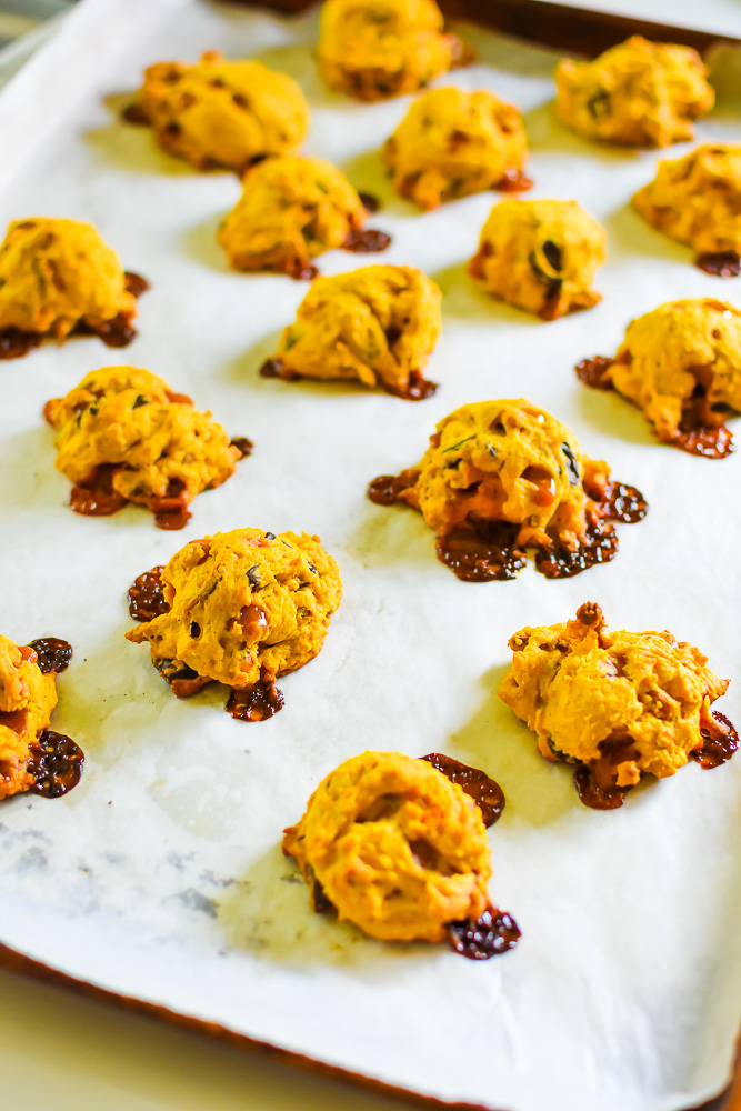 baked pumpkin cookies with gooey caramel, dark chocolate, and crunchy pretzels and walnuts.