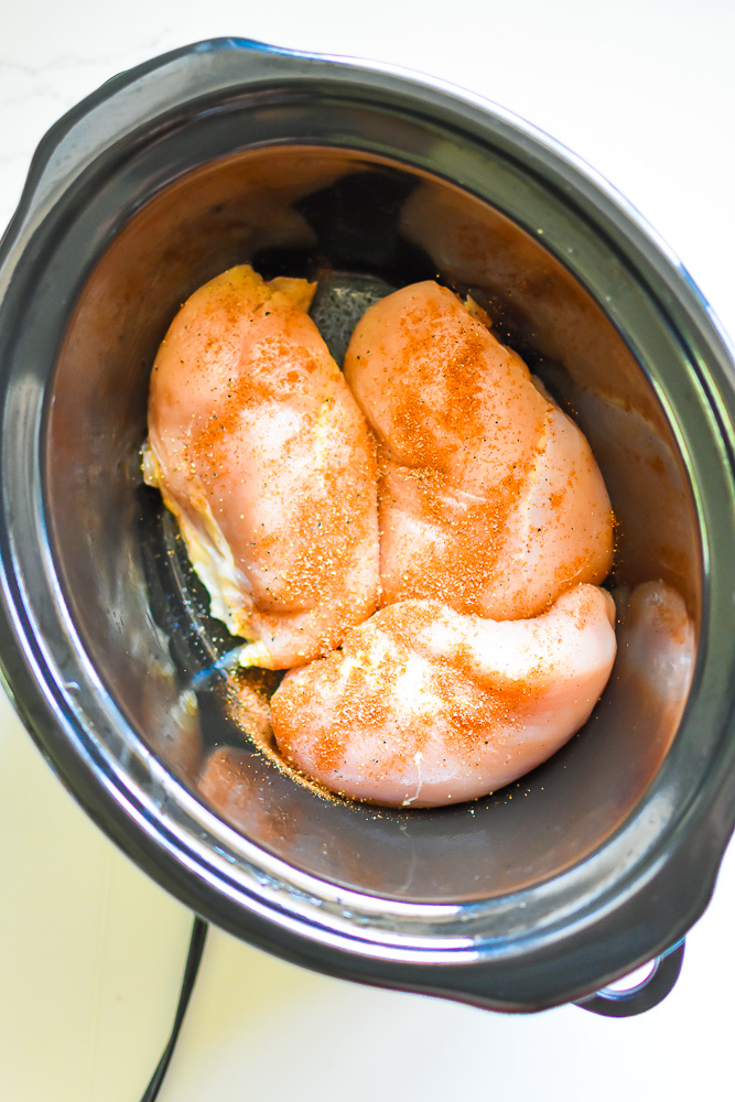 seasoned chicken breast in crockpot.