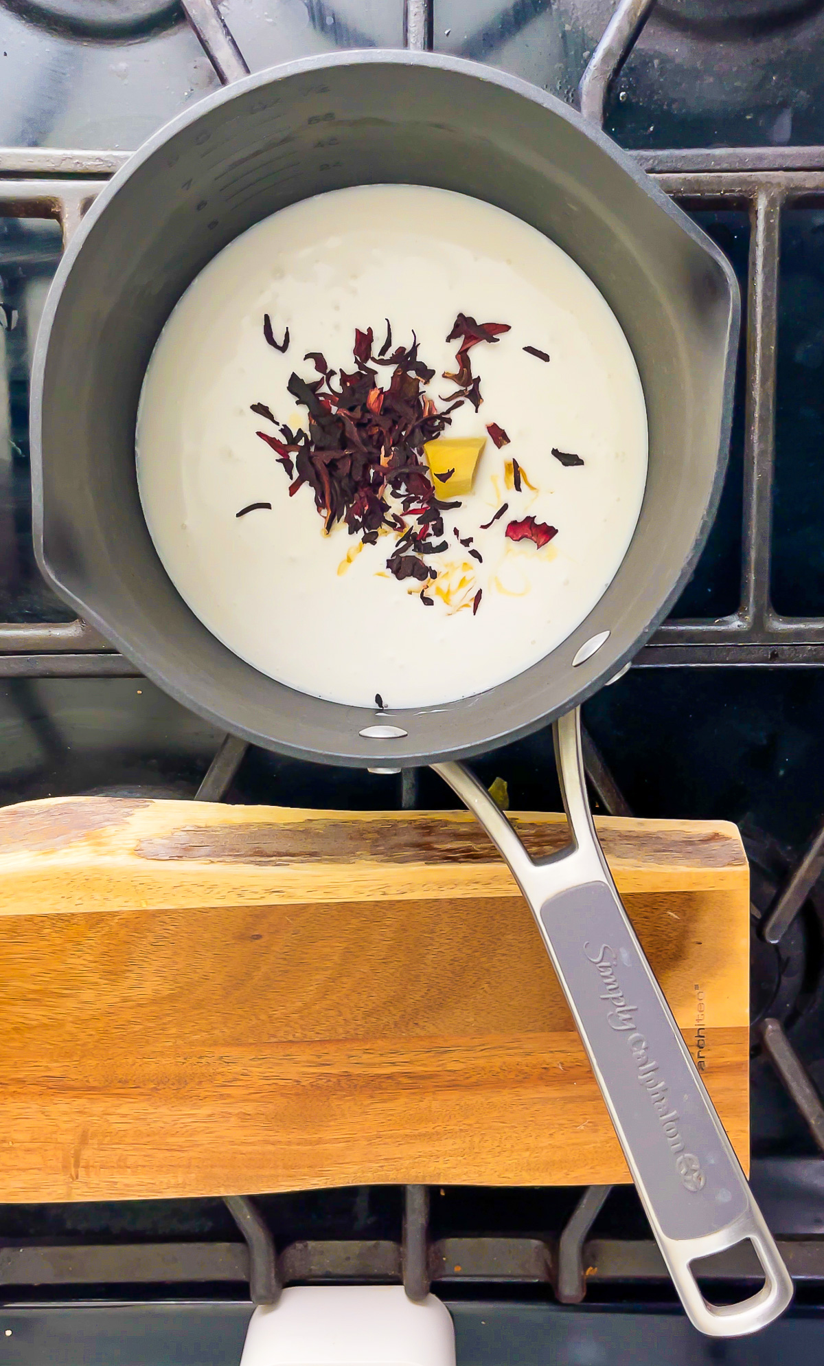 coconut milk, dried hibiscus petals, knob of ginger, and honey in small saucepan.