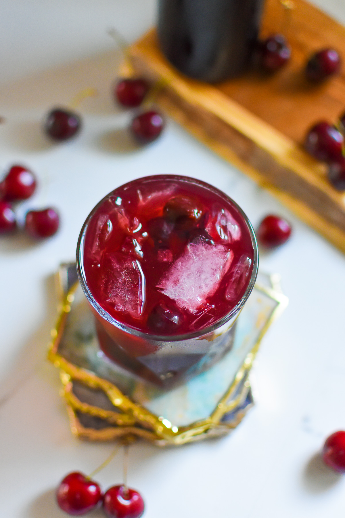 easy to make tart cherry juice mocktail drink for sleep made with apple cider vinegar, and prebiotic soda on the rocks.