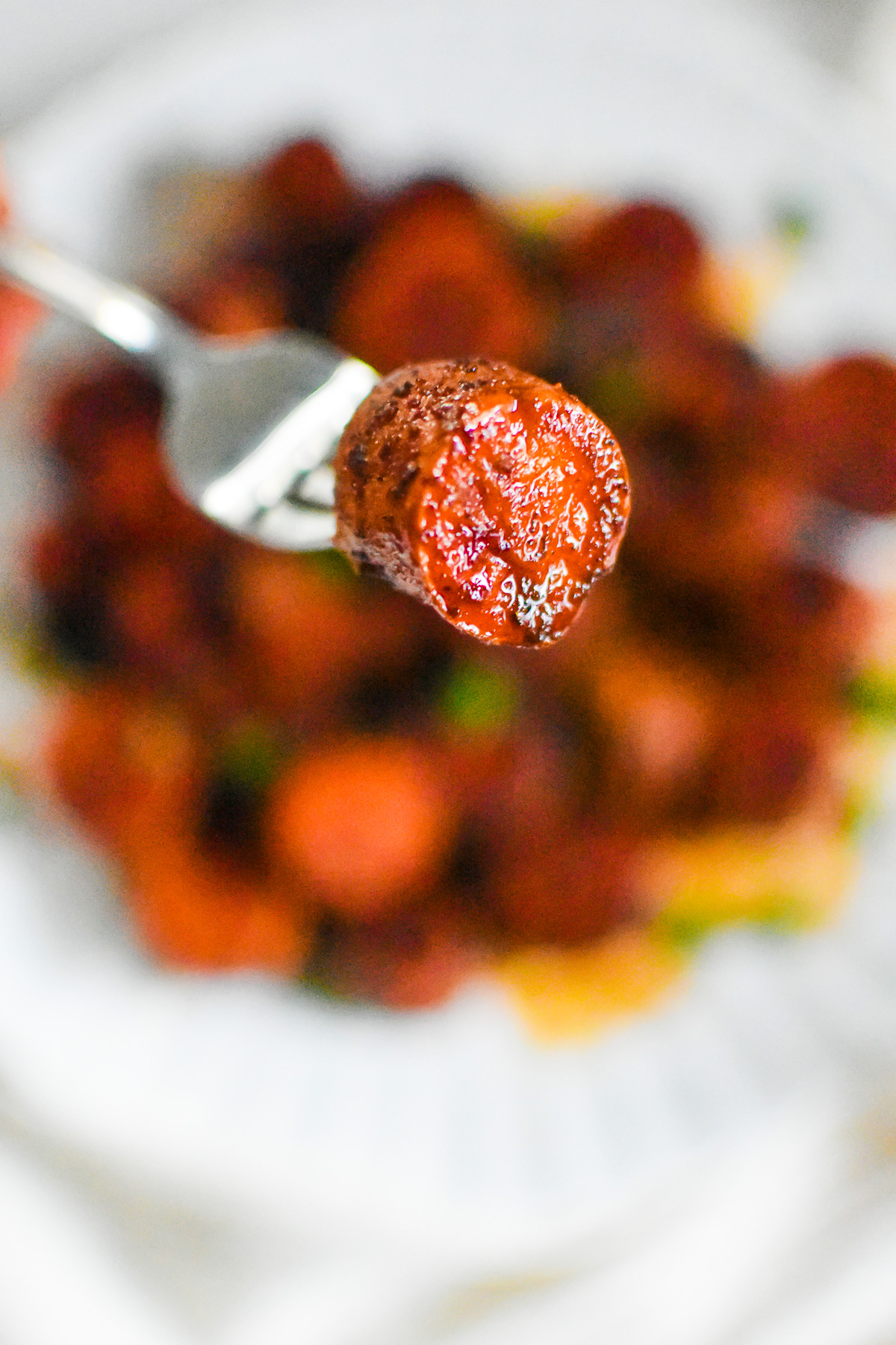 melting sweet potato bite skewered on a dinner fork.