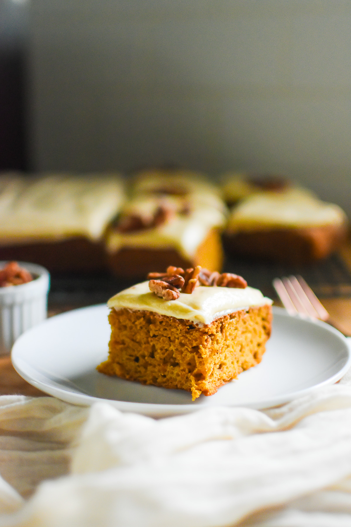 square of scratch-made sweet potato apple cake on white saucer.
