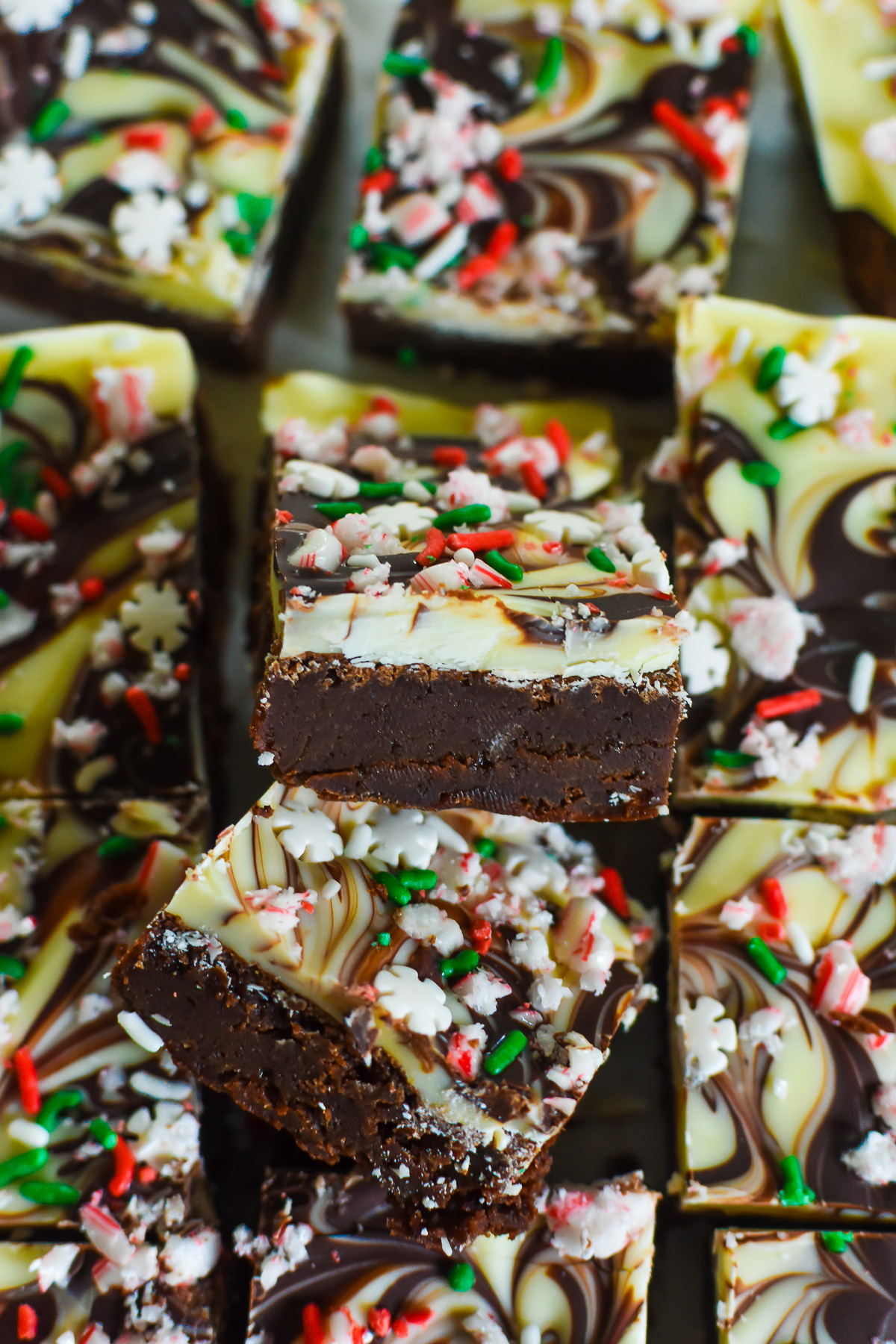 fudgy peppermint bark topped brownies with a marbled white and dark chocolate layer.