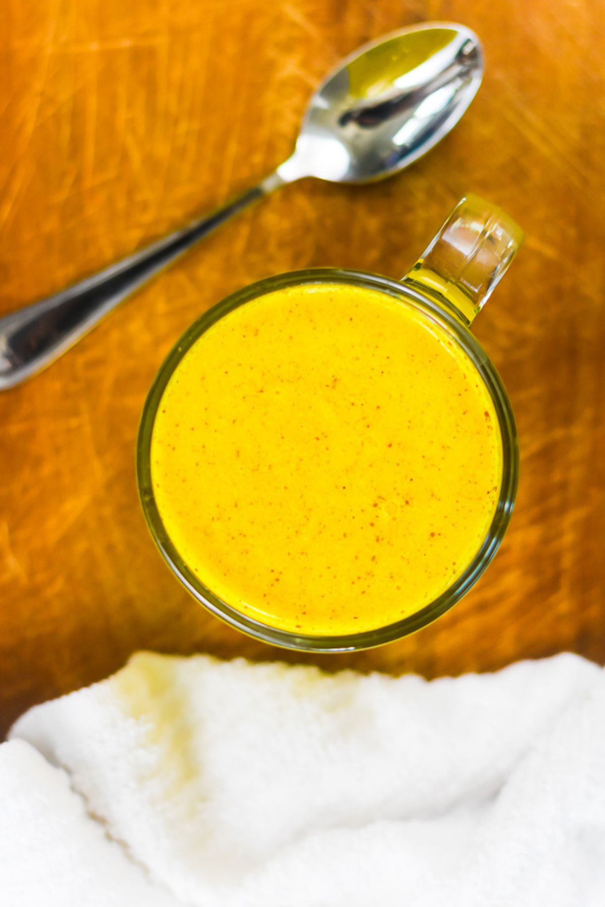 golden milk turmeric tea in a glass mug.