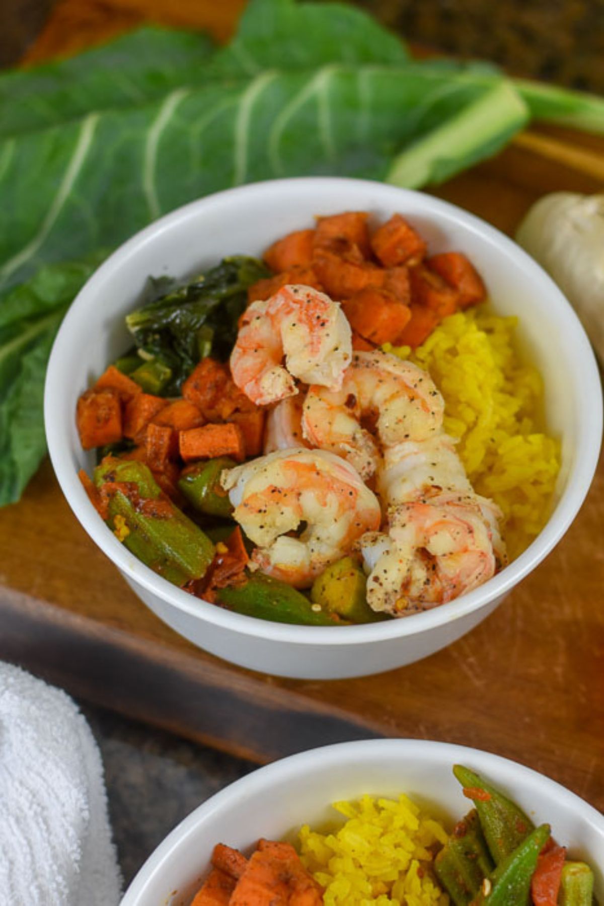 30-minute Soul Food bowl with lemon pepper shrimps, collards, okra, sweet potatoes, and rice.