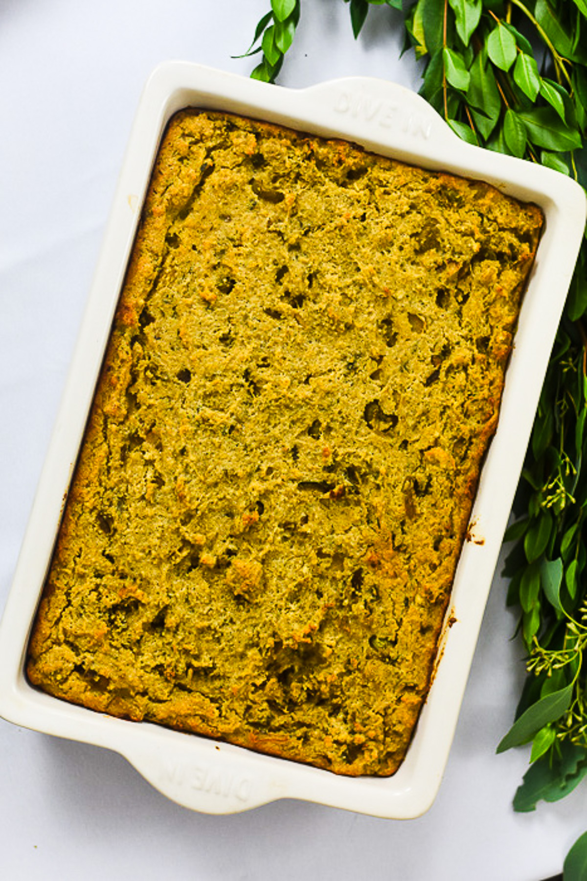 pan of the best Black Southern cornbread dressing made from scratch on a Thanksgiving table.